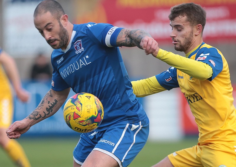 Action from last seasons game as goal scorer Stuart Fleetwood in the lead up to his goal