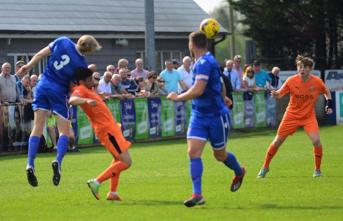 Joe Shepherd wins the header