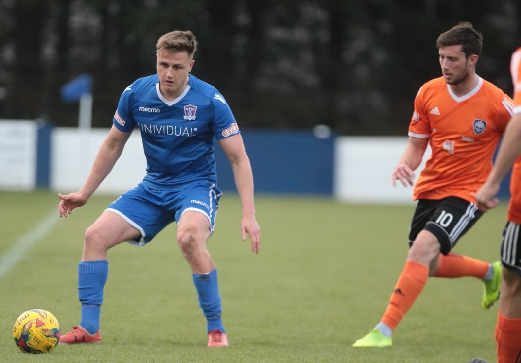 Calvin Dinsley in action against Met Police last April returns to the squad after his loan spell at Evesham United