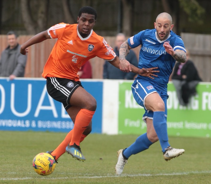 Stuart Fleetwood in battles for the ball in the first half