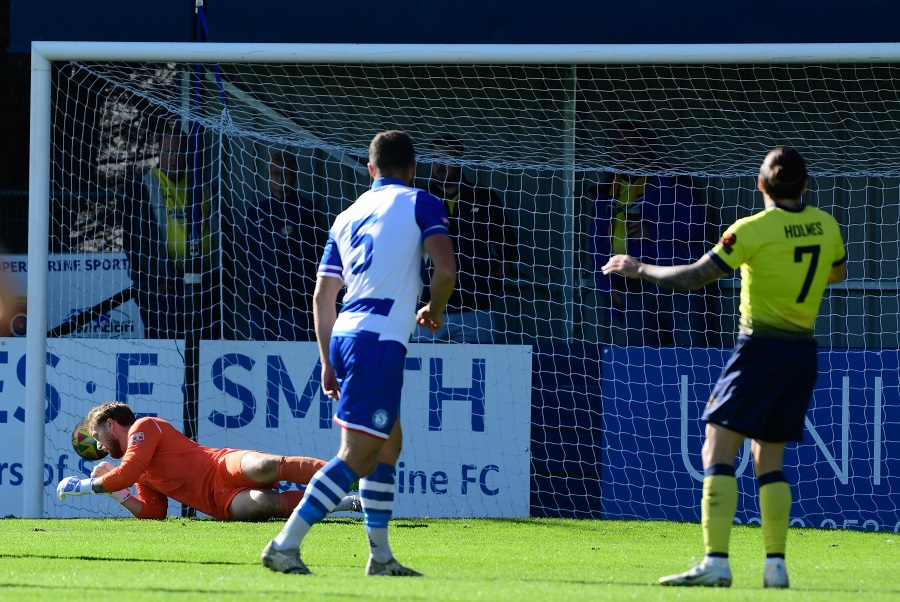 Ricky Holmes’ shot gets past Connor Johns for the opening Farnborough goal