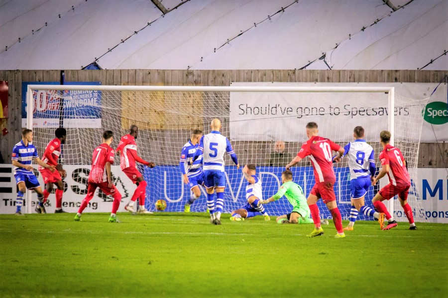 Hayes defender Jerry Wiltshire (6) scores the equaliser through a crowded penalty box