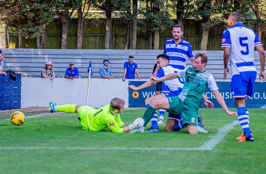 Hendon’s Joe White nipped in between Connor Johns and Tom Sharpe to score Hendon’s goal