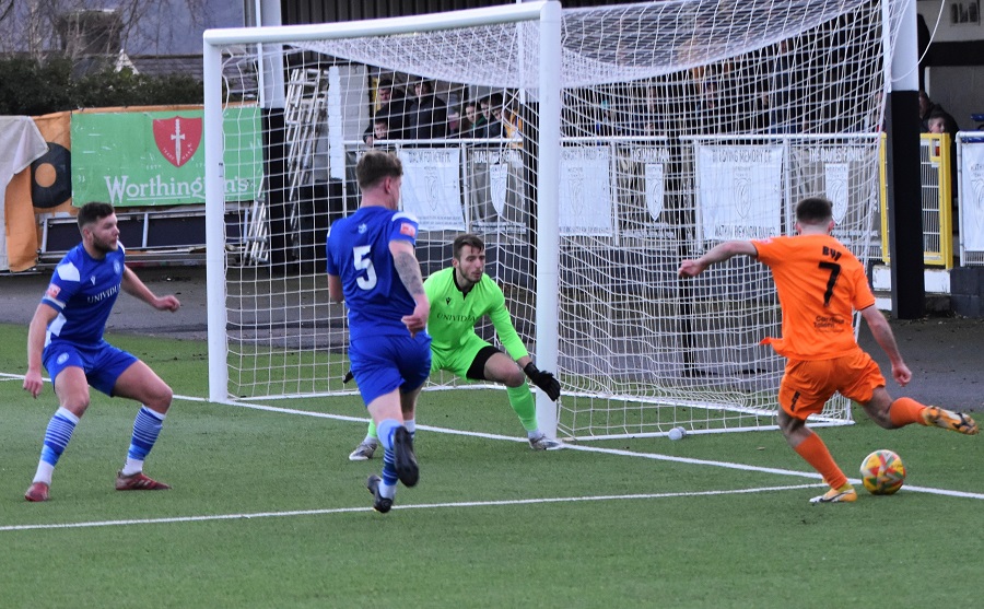 Merthyr’s Frazer Thomas gets to the goal line and pulls the ball back only for Mat Liddiard to score an own goal