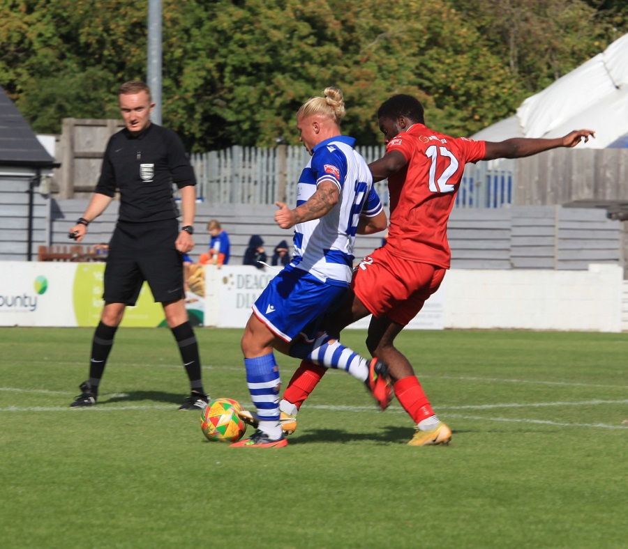 George Dowling wins the ball in midfield