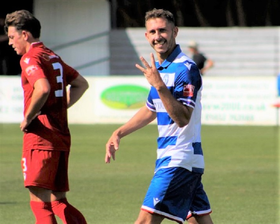 Harry Williams indicates three goals before leaving the pitch to a loud applause