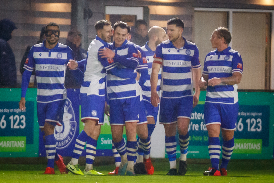 The players celebrate Harry’s goal