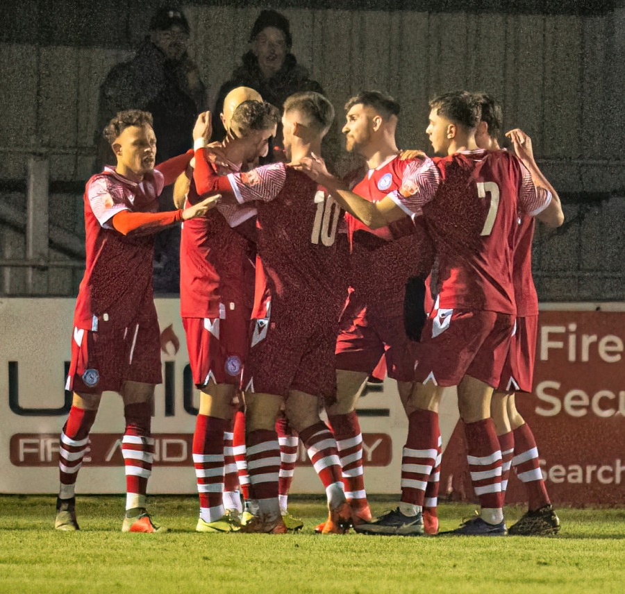 The players celebrate Harry’s goal