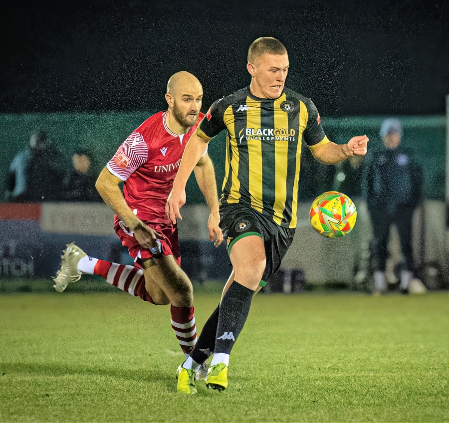 Jamie Edge and Poole’s new signing Jake Andrews had a battle in midfield