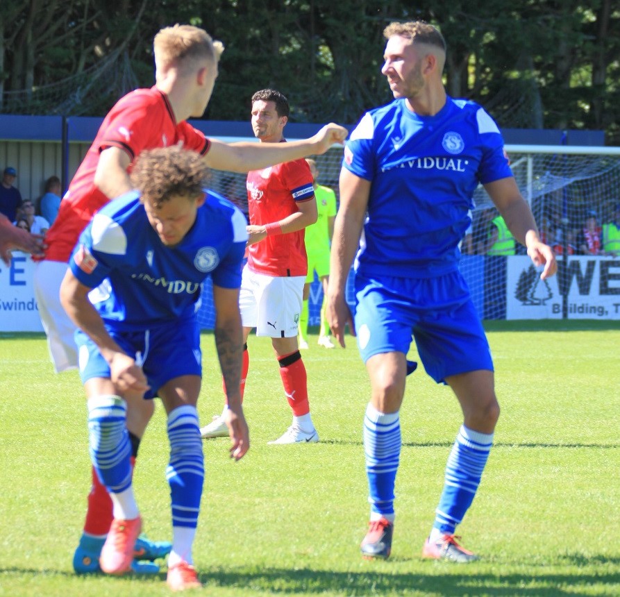 Ryan Campbell and Harry Williams challenge the Town player