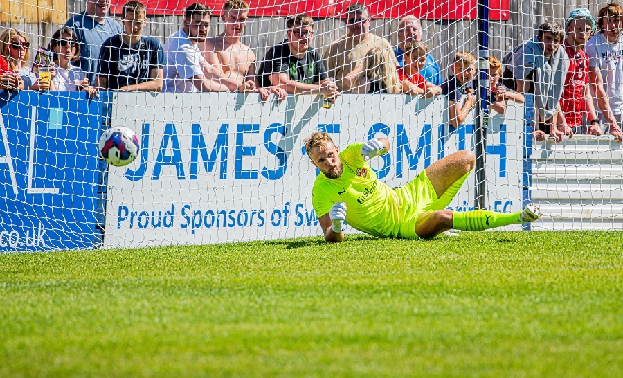 James Harding’s shot gets past Lewis Ward in the Town for the opener