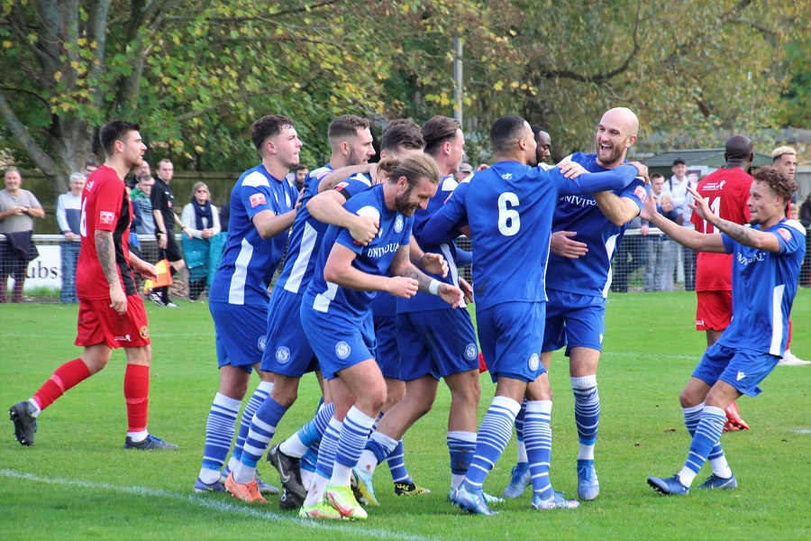 The players celebrate Harry’s opening goal
