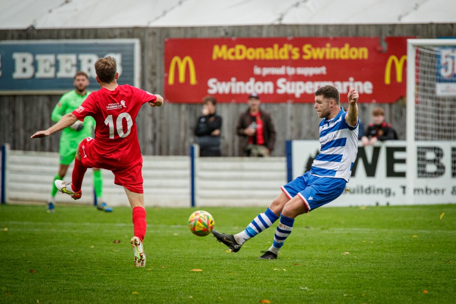 Warren Betley blocks Mat Liddiard’s attempted clearance and the ball flies past keeper Josh Gould for a quick second goal