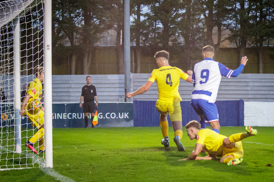 Henry Spalding’s effort is blocked on the line by Barnaby Soady’s right arm