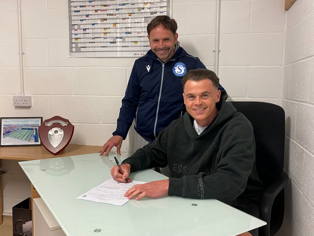 James Harding signs