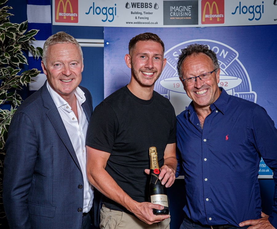 Harry Williams receives his award in recognition of making his 100th start during the 2022/23 season