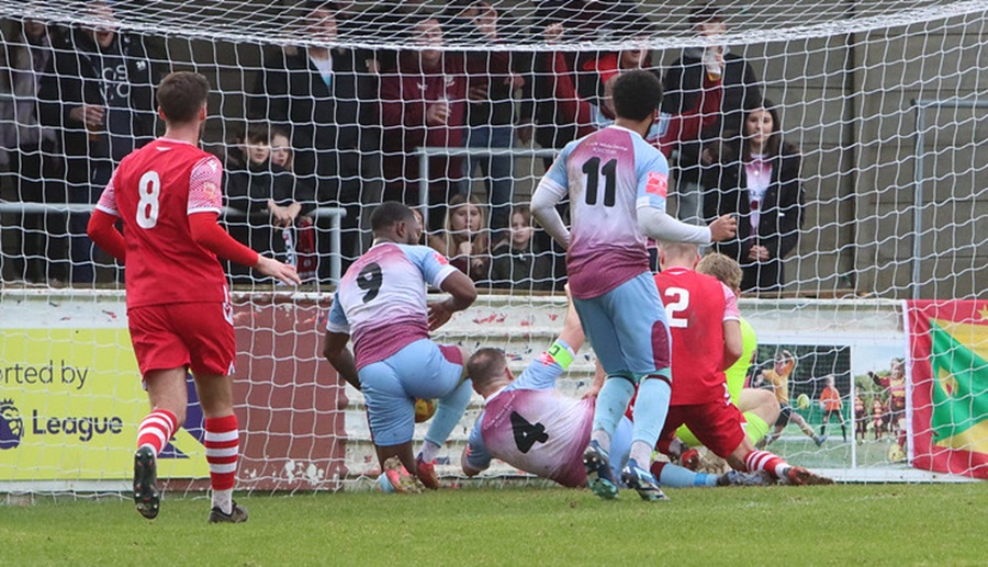 Goalmouth scramble as Steve Brown (4) attempts to get the ball over the goal line