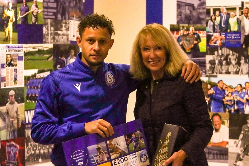 Ryan Campbell receives his POM award from Judi Moore