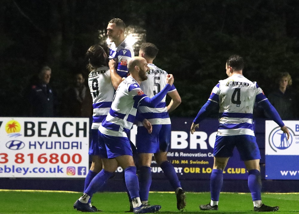 Harry celebrates his goal with his teammates