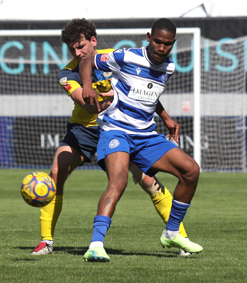 Sid Gbla effectively shields the ball from his marker