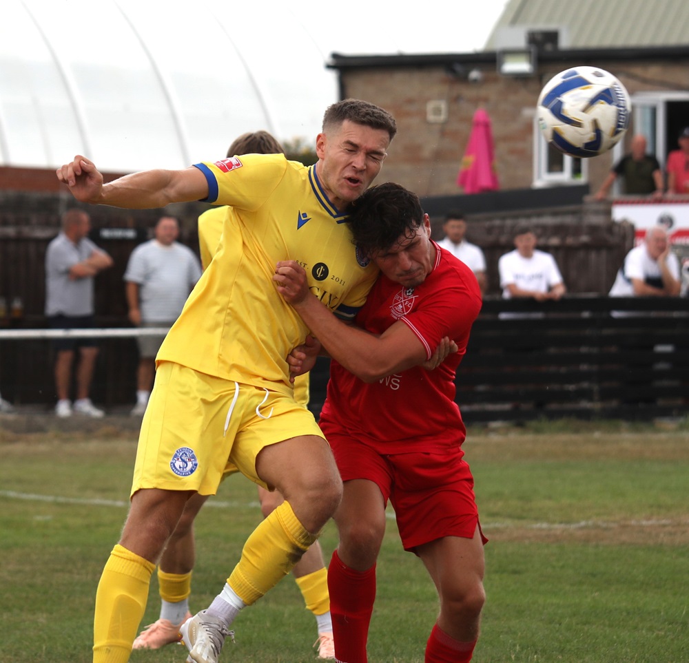 Sam Turl gets his head to the ball first