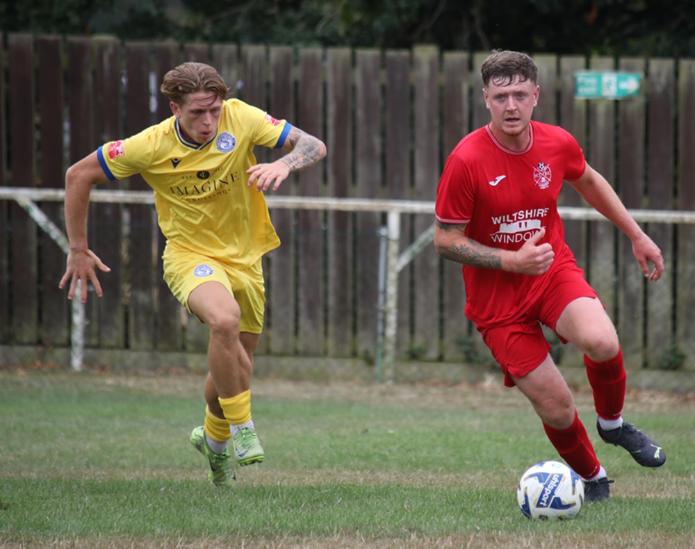 Former Marine player Leon Morrison is chased by Frankie Monks