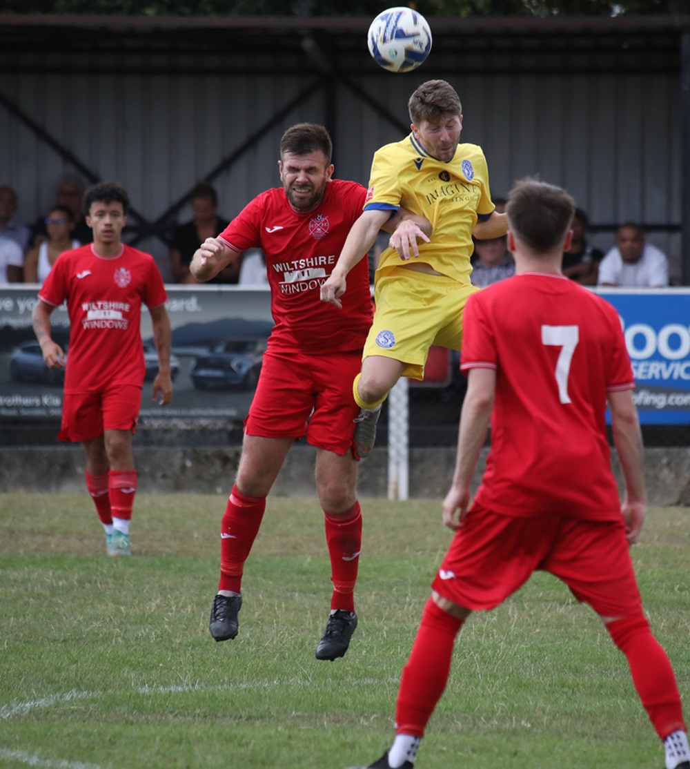 Joe Selman gets up above the taller Highworth defender!