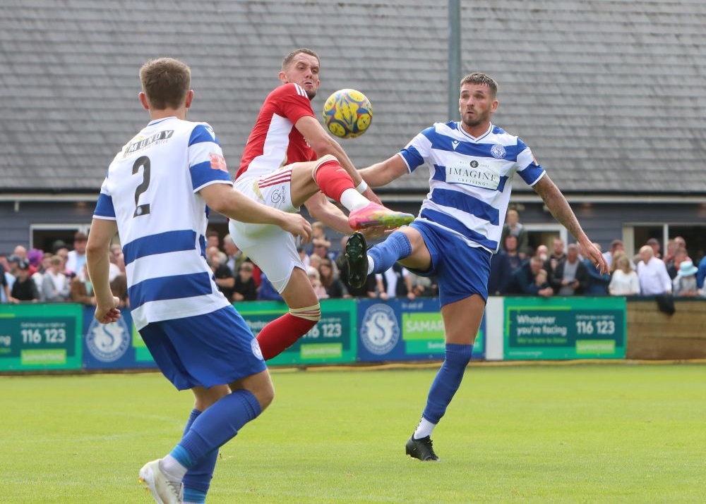 Sam Turl and Dawid Regula challenge for the ball