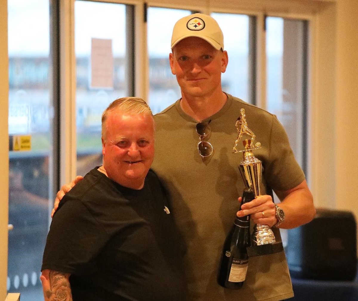 Luke Purnell receiving the Supporters’ Player of the Year Award from long time supporter Steve Gunnett