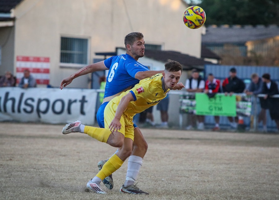 Dan Warre wins an early header