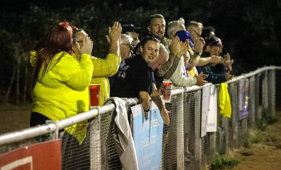 Some of the many Marine supporters applaud the win