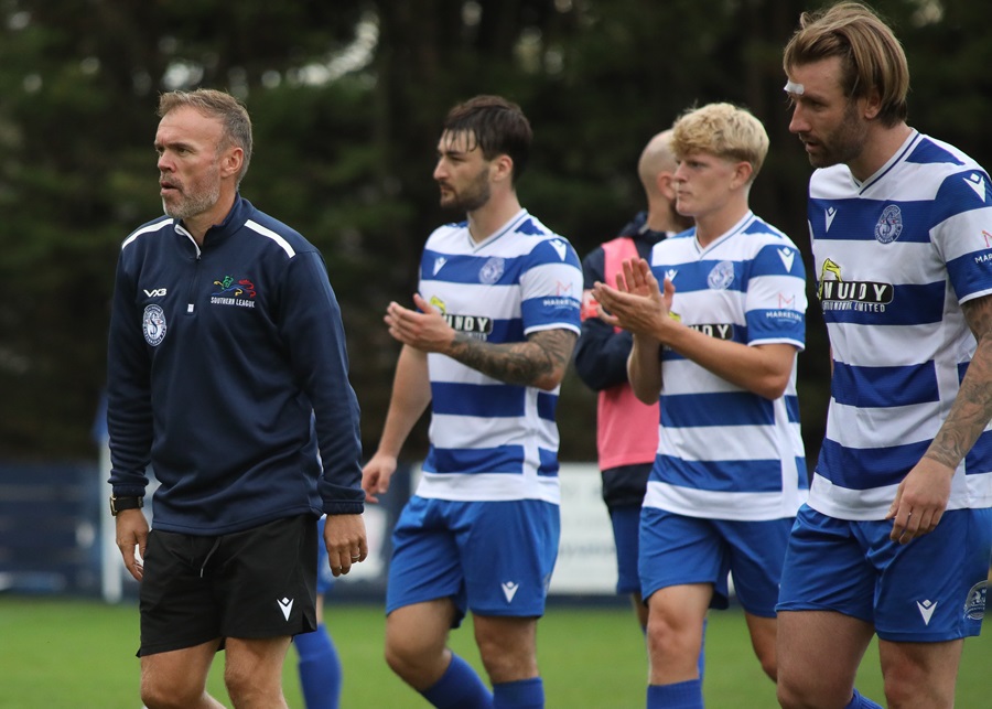 Bobby Wilkinson and some of the players applaud the supporters at the end of the game