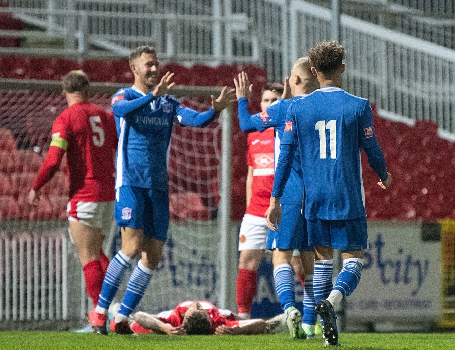 The players celebrate Kieran’s goal and Marine’s forth on the night