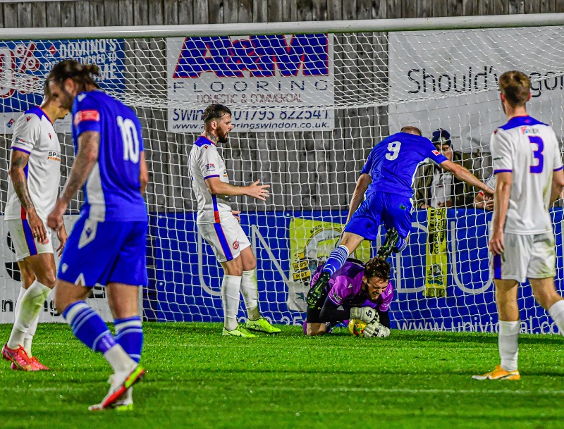 Gosport keeper White just collects the ball before David Pratt