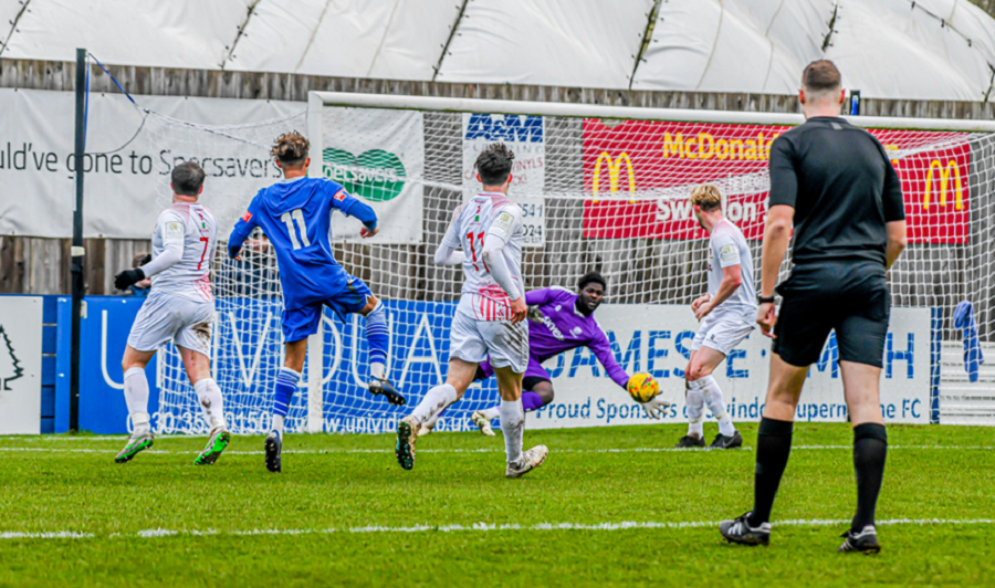 Ryan Campbell’s effort is well saved by Hayes keeper Ravan Constable