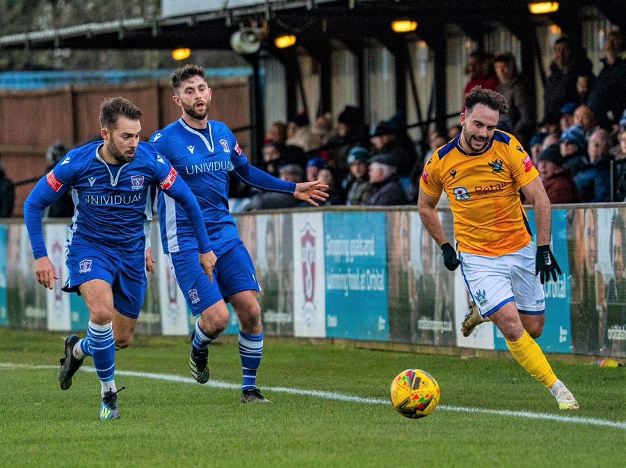 Michael Hopkins chases Salisbury’s Antonio Diaz