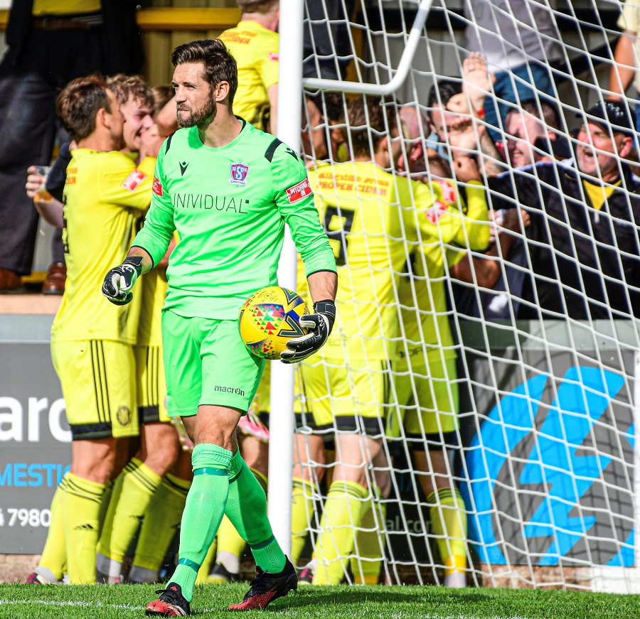 Martin Horsell’s look says it all as the Tivvy players celebrate the opening goal