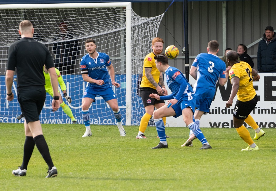 Nial Thompson’s shot takes a deflection of Tom Sharpe (8) for Truro’s goal