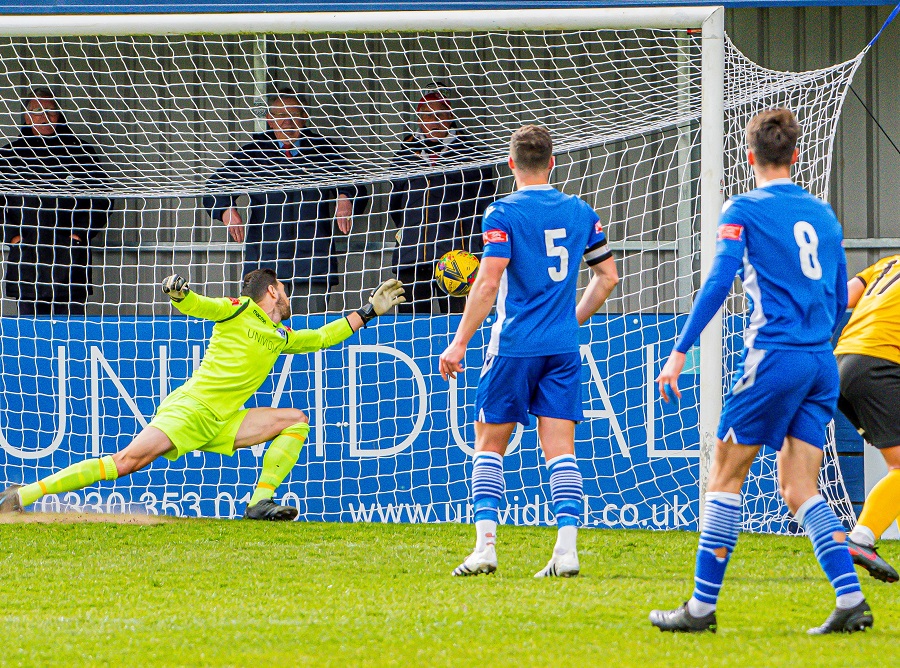 Nial Thompson’s shot takes a deflection of Tom Sharpe (8) for Truro’s goal