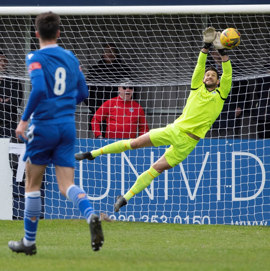 Truro’s Nial Thompson shoots for goal but Martin Horsell pushes the ball past the post