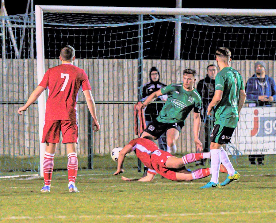 Mat Liddiard’s diving header goes in off the post for the winning goal