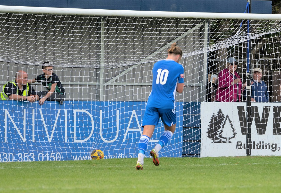 Ryan Campbell scores after sitting down the Wimborne keeper