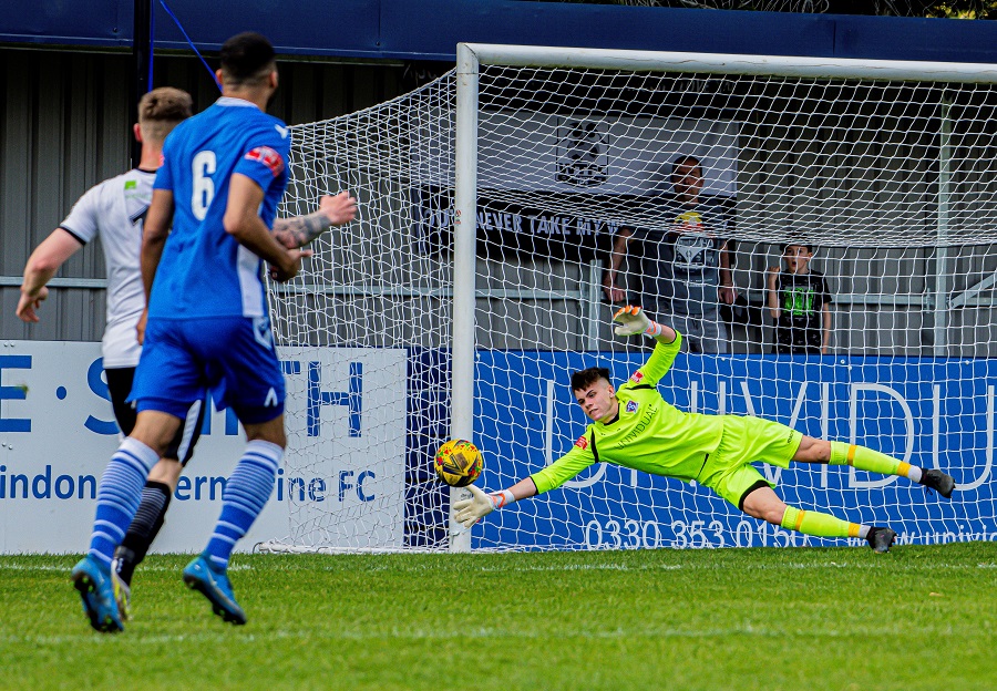 Louis Evans saves well from Wimborne’s Dan Bartlett