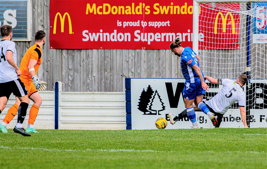 Conor McDonagh’s backheel is blocked by Wimborne’s Scott Arnold