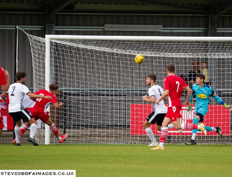 Ryan Campbell gets in low at the far post to head home the winner