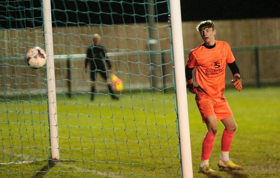 Harry Williams header goes over the Chippenham keeper Ellis Parker