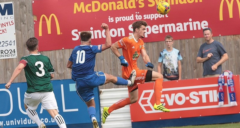 Conor McDonagh challenges the Hendon keeper in the first half