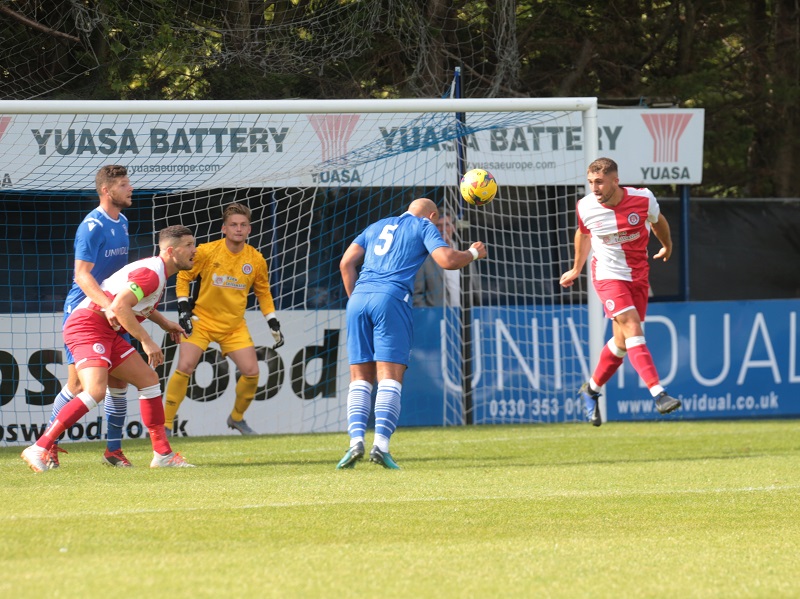 New signing Simon Downer heads just wide