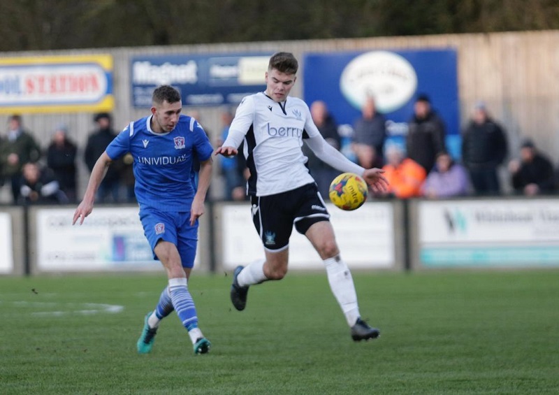 Harry Williams gets away from Salisbury defender Tom Leak to lob second goal