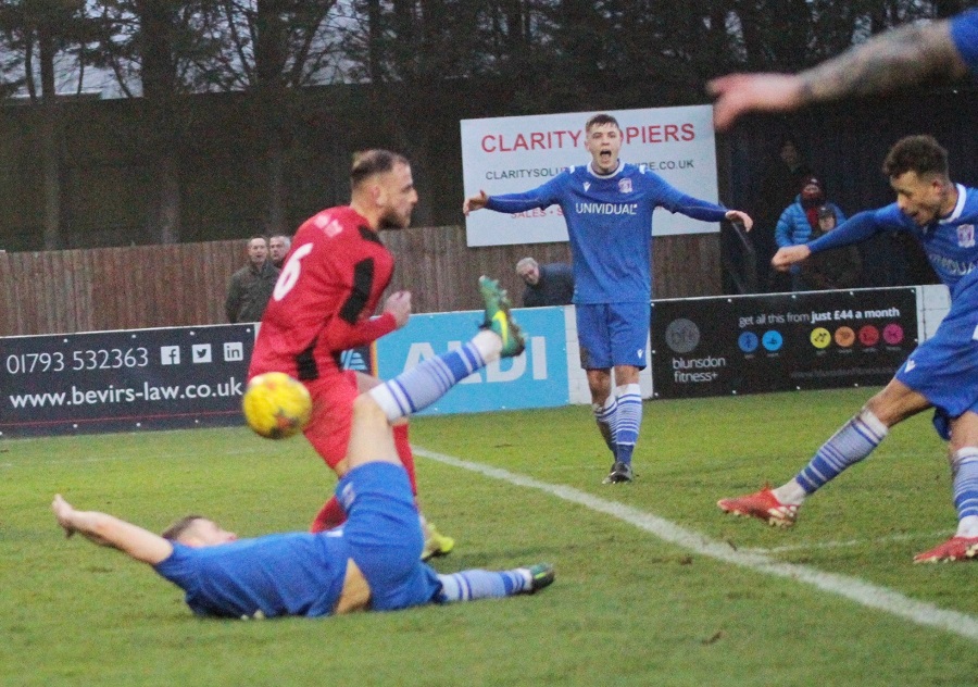 Ryan Campbell shoots and scores Marine’s goal 